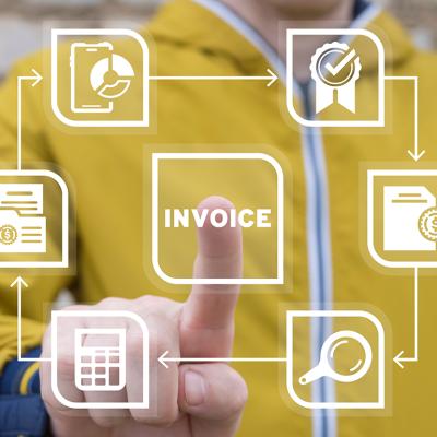 The word "invoice" being pressed by a businessperson in a virtual illustration of using an accounting software.