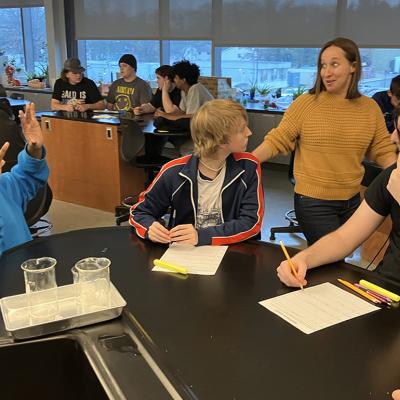 Tech Valley High School English teacher Catherine Eisele (center) leads an impromptu discussion with students during a class.