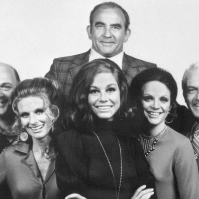 The cast of 'The Mary Tyler Moore Show,' from left to right: Gavin MacLeod, Cloris Leachman, Mary Tyler Moore, Valerie Harper, and Ted Knight. At top, is Ed Asner.