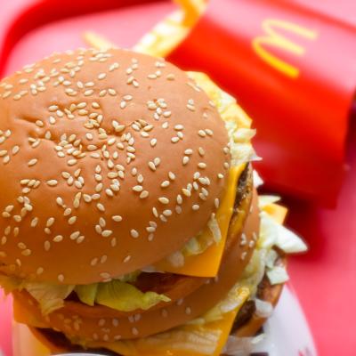 Big mac burger and fries from McDonald's on a red tray.