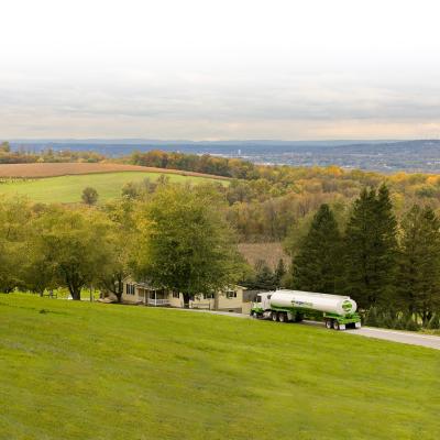A tank truck driving on a highway.