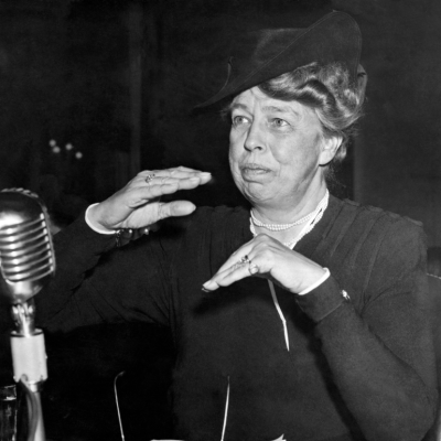 Eleanor Roosevelt in front of a microphone at a hearing in Washington DC, 1942. 