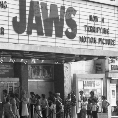 Crowds line up outside a movie theater to see 'Jaws,' circa 1975