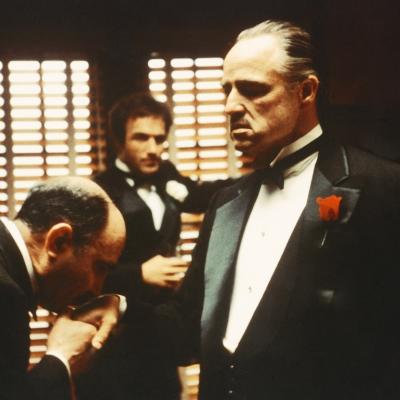 Salvatore Corsitto as Bonasera, James Caan as Sonny Corleone, and Marlon Brando as Don Vito Corleone in "The Godfather."
