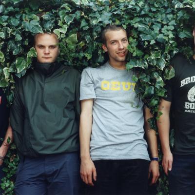 Coldplay pose for a group portrait in the UK, July 1. (L–R) Guy Berryman, Will Champion, Chris Martin, and Jonny Buckland.