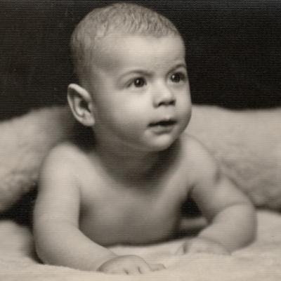 Small baby lying prone position, circa 1950s.