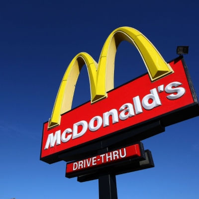 A sign stands outside of a McDonald's restaurant