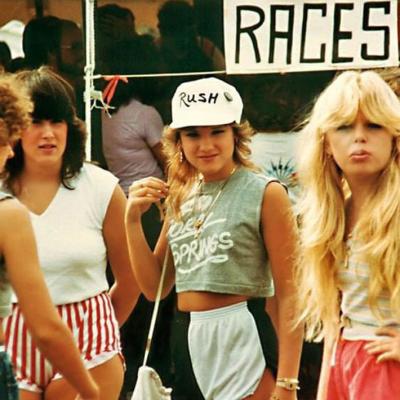 Four women hanging out at a festival