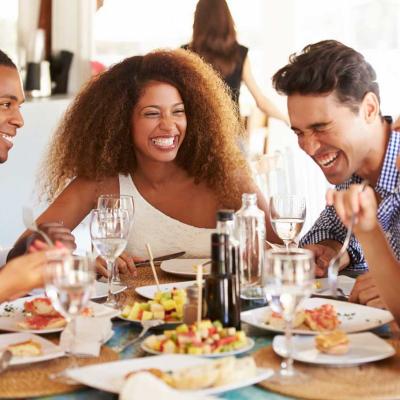 Group of friends enjoying a meal in a restaurant