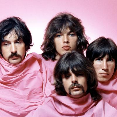 Pink Floyd pose for a portrait in Los Angeles in August 1968. (L–R) Nick Mason, Dave Gilmour, Rick Wright (center front), and Roger Waters.
