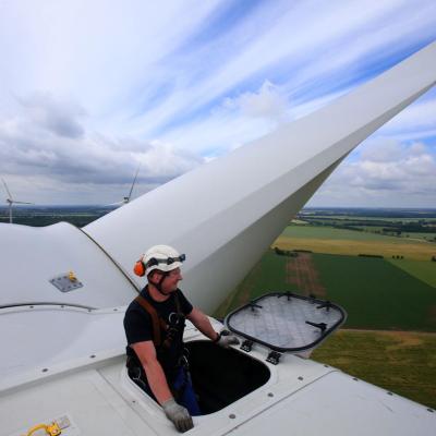 Service technician Andre Sebesta sits on the new Vestas V112 wind turbine at the wind farm in Barkhagen, Germany