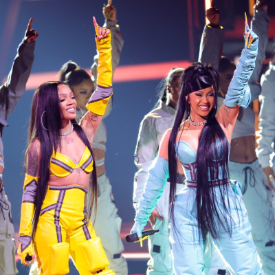GloRilla and Cardi B perform onstage at the 2022 American Music Awards.