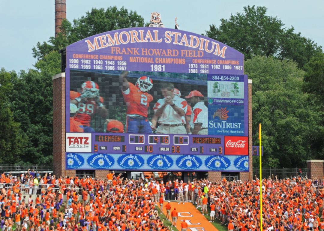 A scoreboard and crowded Clemson game.