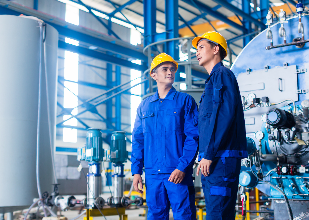 Two workers in a manufacturing plant.