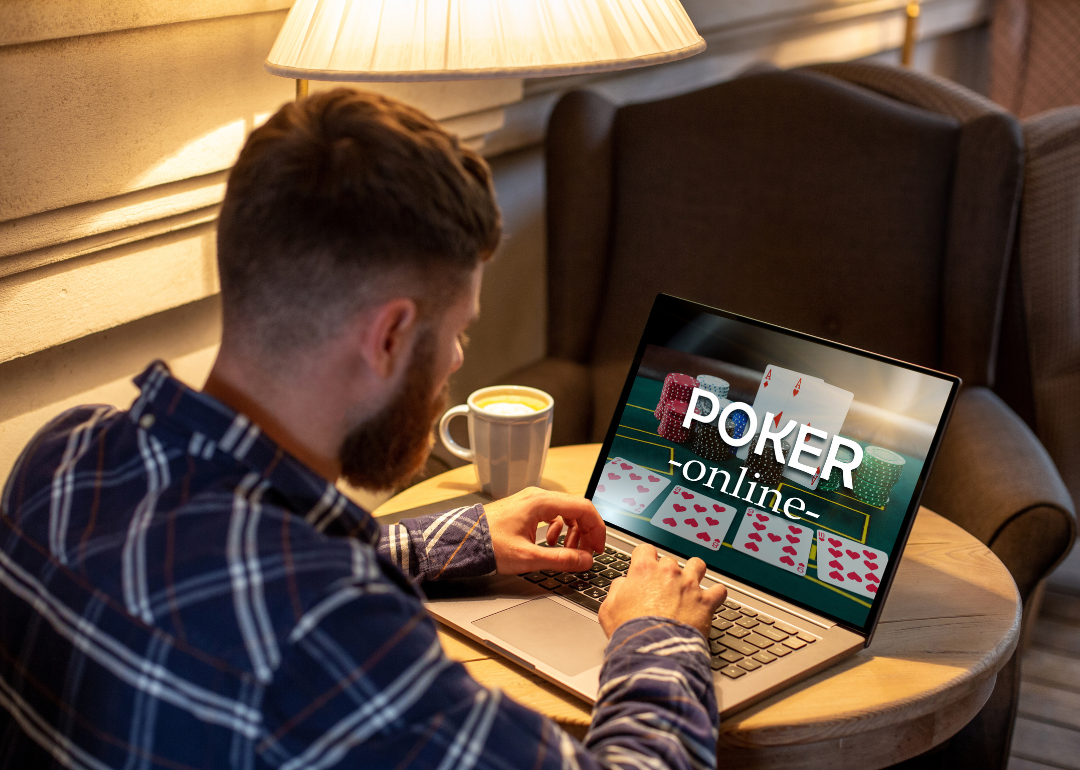 A person playing poker online using their computer