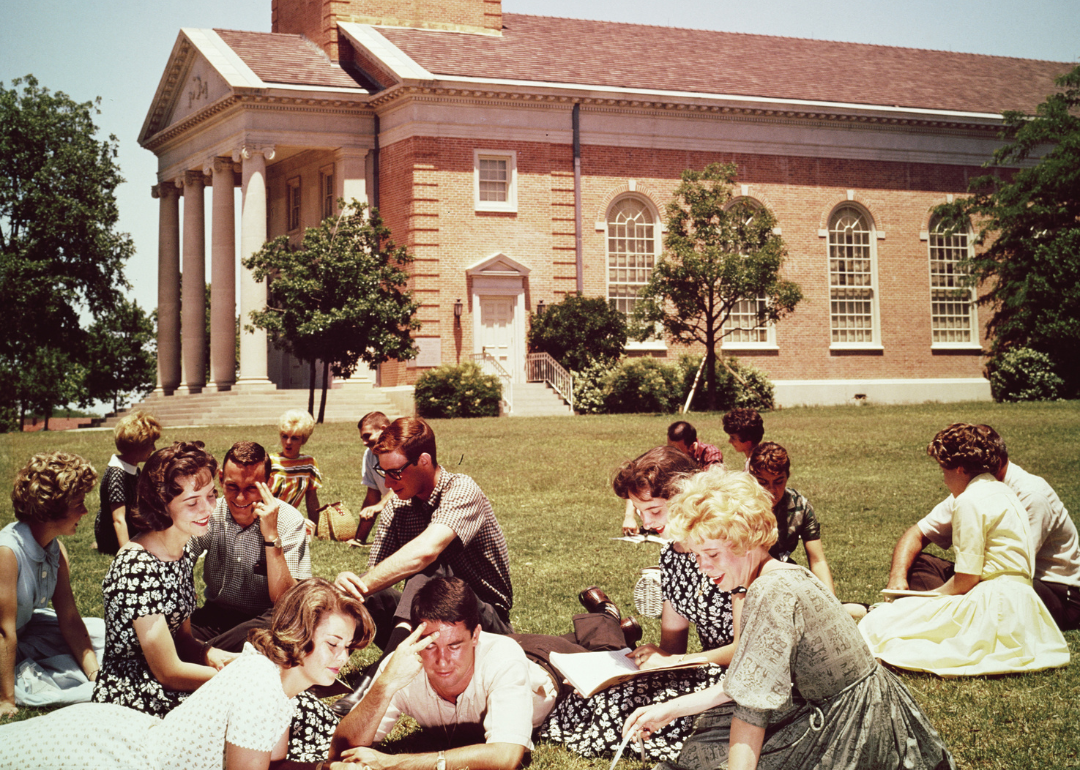 College students studying on a campus lawn in 1970.