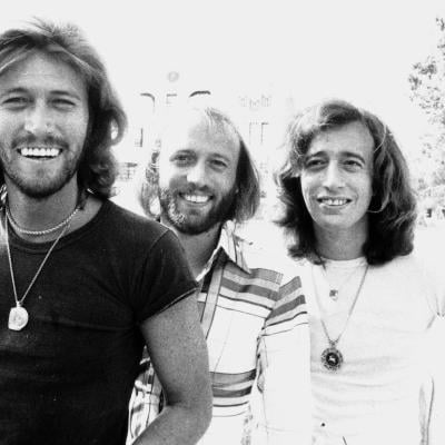 The Bee Gees pose for a portrait.