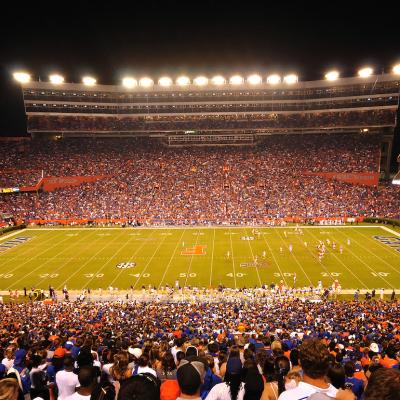 A packed University of Florida stadium at night. 