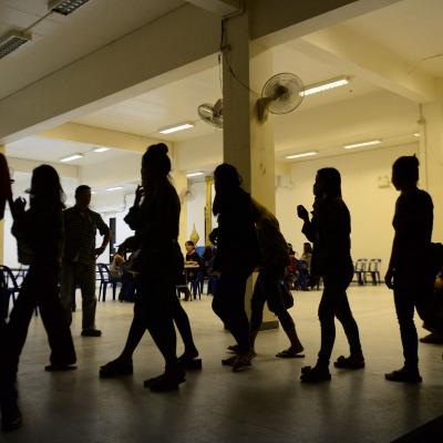 A group of foreign women rounded up by police from karaoke bars in Thailand.