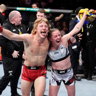 Paddy Pimblett of England and Molly McCann of England celebrate a victory.