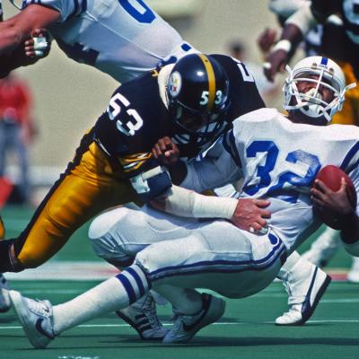Linebacker Bryan Hinkle of the Pittsburgh Steelers tackles running back Randy McMillan of the Indianapolis Colts.