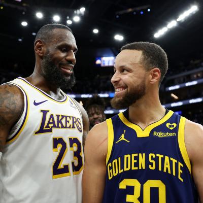 LeBron James of the Los Angeles Lakers and Stephen Curry of the Golden State Warriors talk to each other.