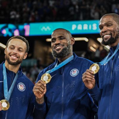 Stephen Curry, LeBron James and Kevin Durant pose after the men's Gold Medal basketball match.