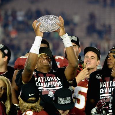 Jameis Winston of the Florida State Seminoles holds the trophy after defeating Auburn in the 2014 National Championship Game.