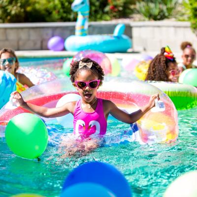 Little girl on pool inflatable.