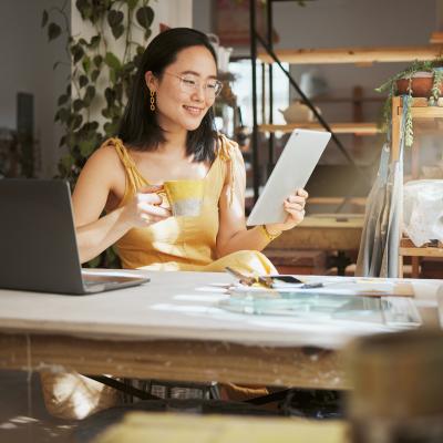 Business owner with coffee and ipad.