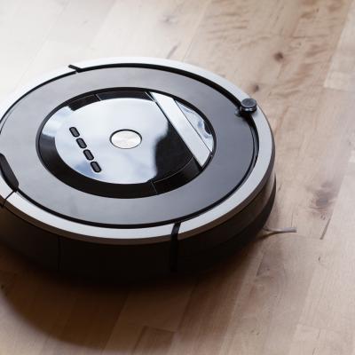 Robotic vacuum cleaner on laminate wood floor