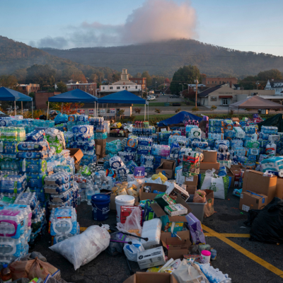 Stacks of donated water and supplies after Hurricane Helene.