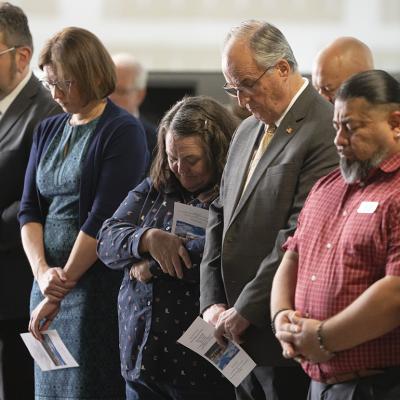 Cochise County Supervisor Peggy Judd, center, bows her head in prayer during the inauguration of the Southern Arizona Regional Border Operations Center in Sierra Vista, Arizona.