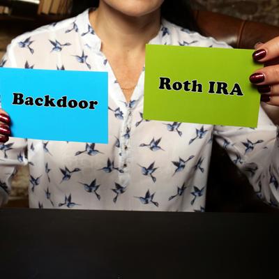 Person holding up two notes with "backdoor" and "Roth IRA" written on each.