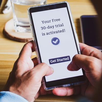 A user is seen activating a 30-day free trial of an app.