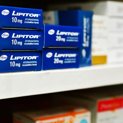 Boxes of Lipitor on a pharmacy shelf.