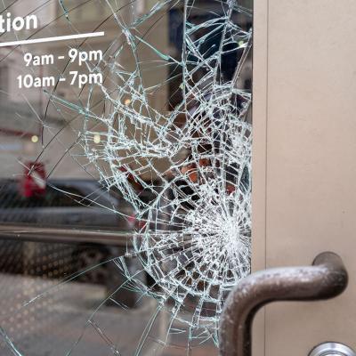 Broken shattered window of a store.