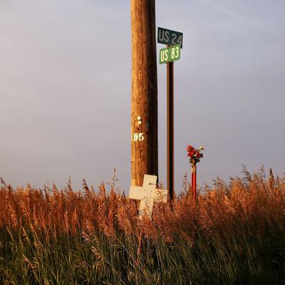 A cross marks the spot where people lost their lives in a car crash in Colby, Kansas. 