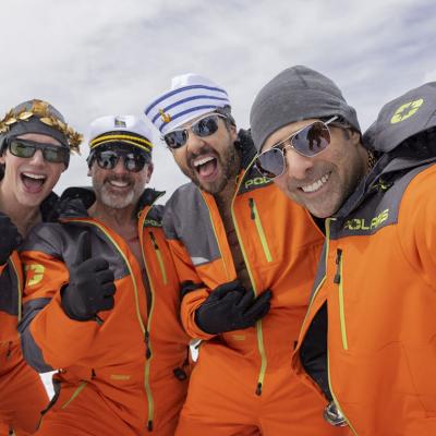 enis (Cory Michael Smith), Randall (Steve Carell), Jeff (Ramy Youssef) and Souper (Jason Schwartzman), from left, dressed in orange jackets in the show Mountainhead.