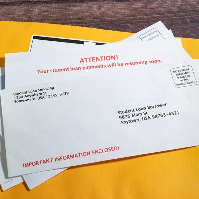 Pile of student loan notices sent by mail.
