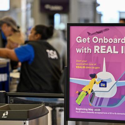 Air travelers go though TSA security at John Wayne Airport in Santa Ana, California.
