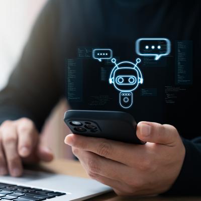 Businessman using smartphone to connect to an AI chatbot.