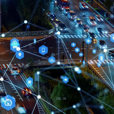 Cars on road during nighttime illustrated with tracking technologies.