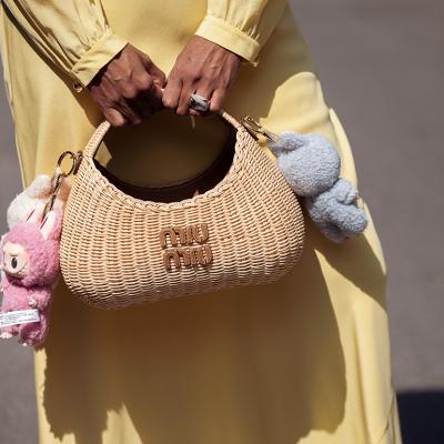Zufi Alexander's straw Miu Miu bag attached with Labubu charms.