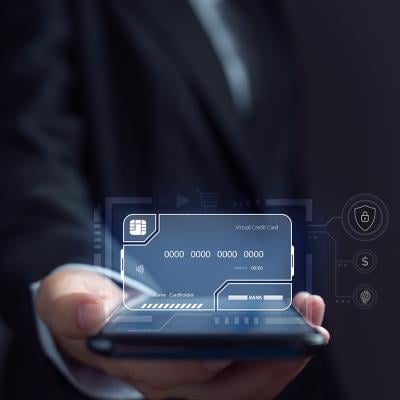 Businessman using an electronic credit card illustrated as a virtual screen.