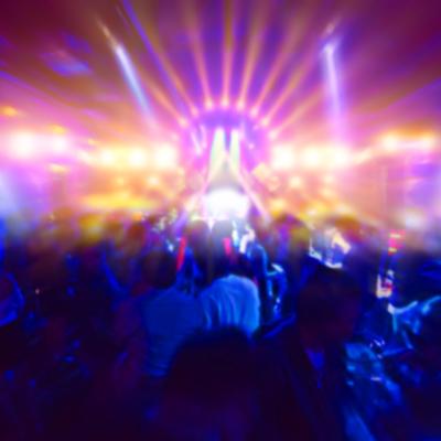 Concert crowd in front of bright stage lights.