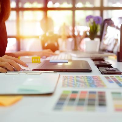 A young graphic designer at work in office.