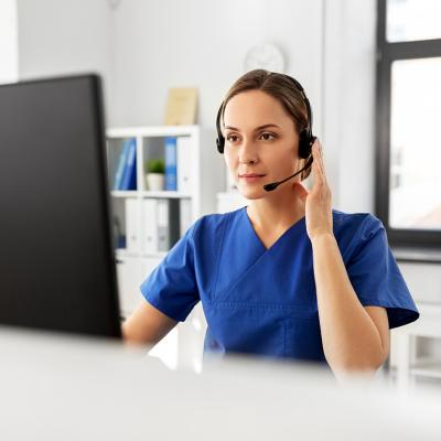 A nurse on a virtual consultation.