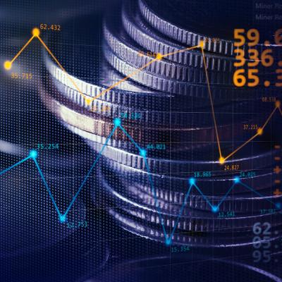 Stack of coins illustrated with stock exchange graphics.