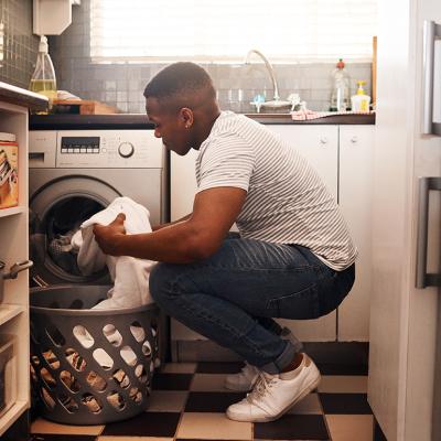 Man doing laundry at home.